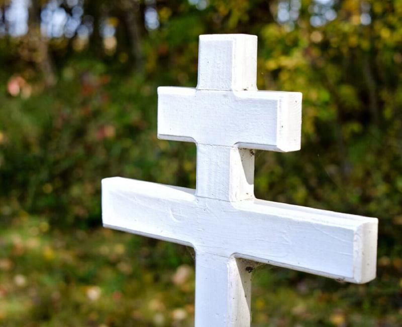 A simple white patriarchal cross