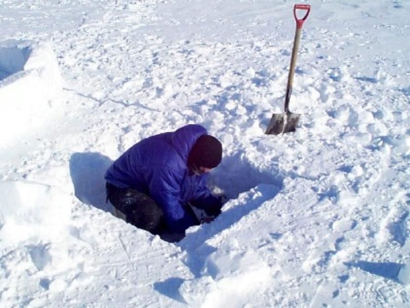 Tim S. cuts out a block.