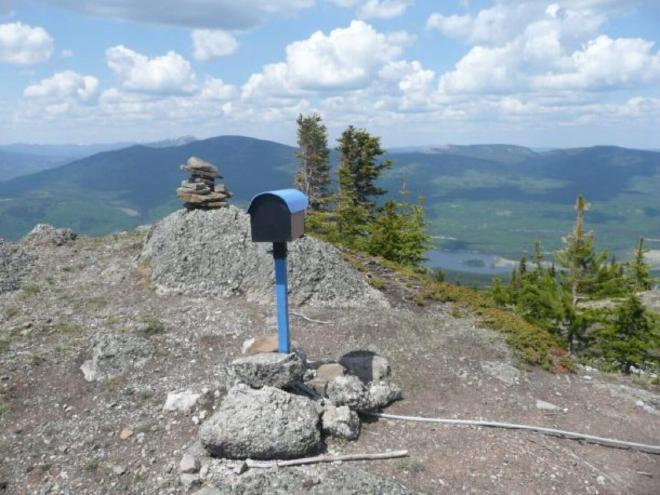 The cairn box and an inukshuk at the summit of Mt. Louie